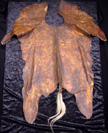 Turkana boy's overcoat / bed